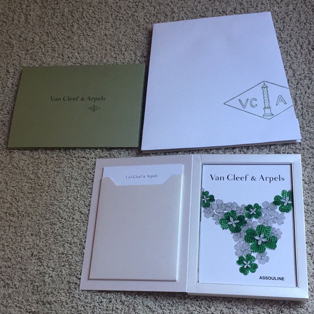 Van Cleef and Arpels shopping bag and book.